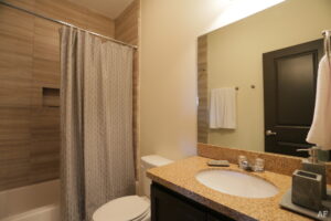Merida Vista Apartments by Corrinthian Asset Management Interior Bathroom with Shower, Washroom, and Toilet View