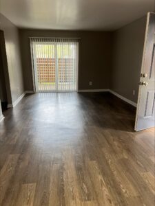 Avalon Floor Plan Empty Living and Dining Room View by Trailwood Village Apartments - Unit 714