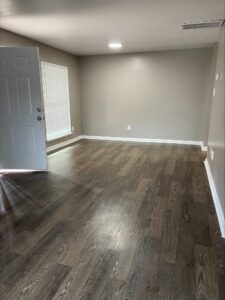 Avalon Floor Plan Empty Living and Dining Room with White Light View by Trailwood Village Apartments - Unit 714