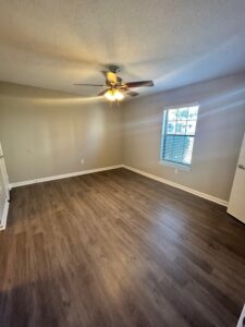 Edgewater Pointe Apartments Empty Interior with Open Room View with Ceiling Fan Light by Corinthian Asset Management