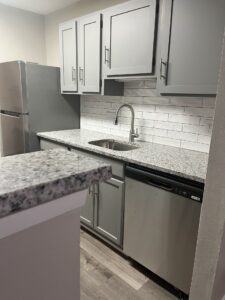 Edgewater Pointe Apartments Sneak Peak to Interior Kitchen Room Sink with Fridge View by Corinthian Asset Management