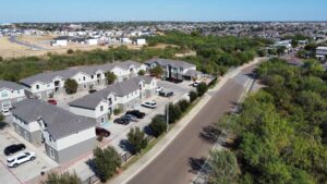 Aerial view of La Joya apartments, a residential complex featuring multiple buildings and adjacent parking lots