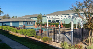 Palm Isle Apartment - Fence and Pool View