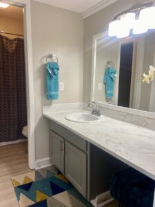 Palm Isle Apartment Interior Bathroom Counter with Marble Top View