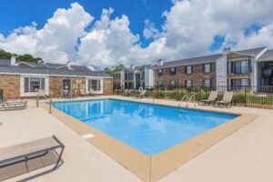 Inviting pool scene at Edgewater Pointe Apartments, showcasing upscale living in a tranquil setting in Biloxi